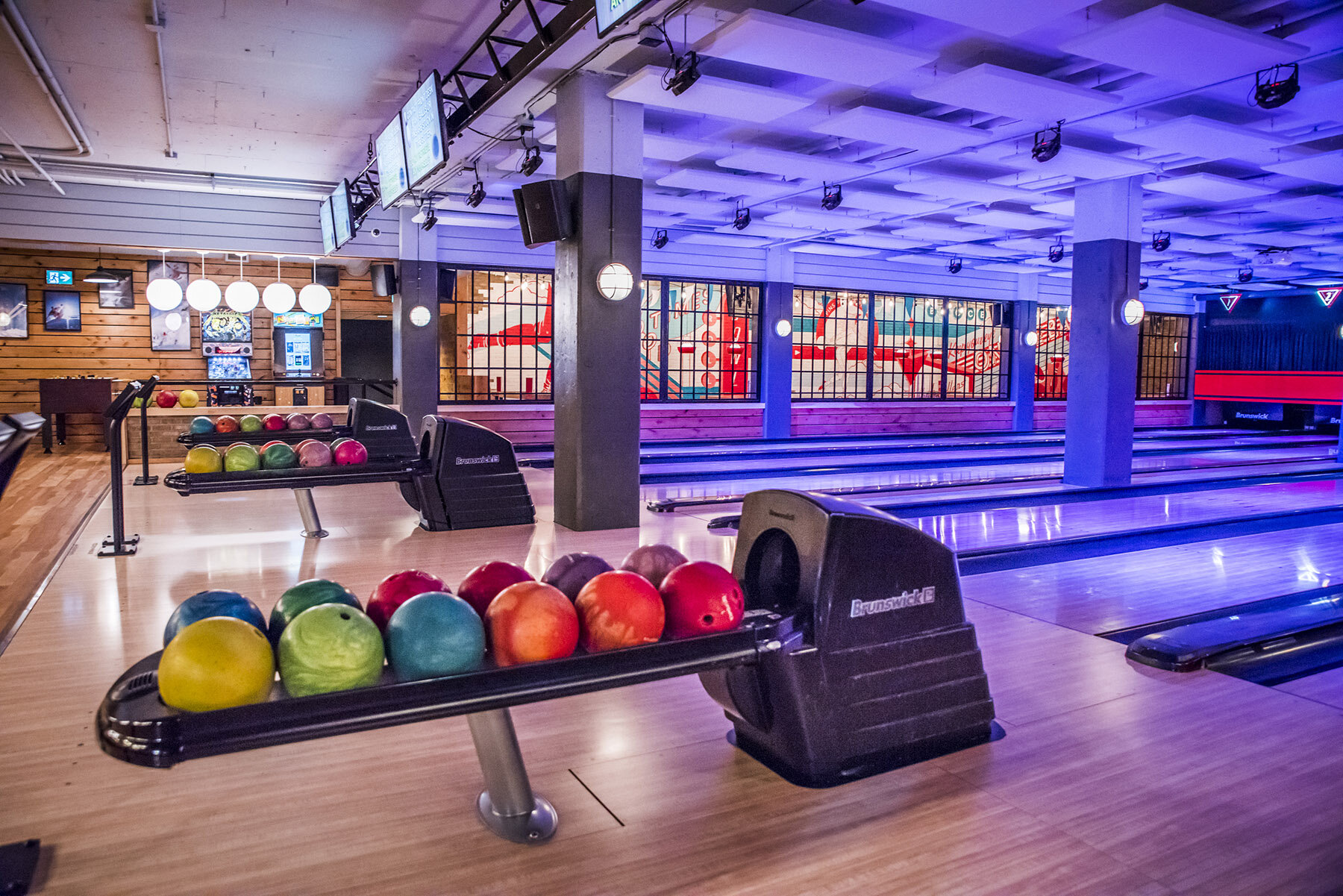Bowling lanes and colourful bowling balls at High Rollers in Banff