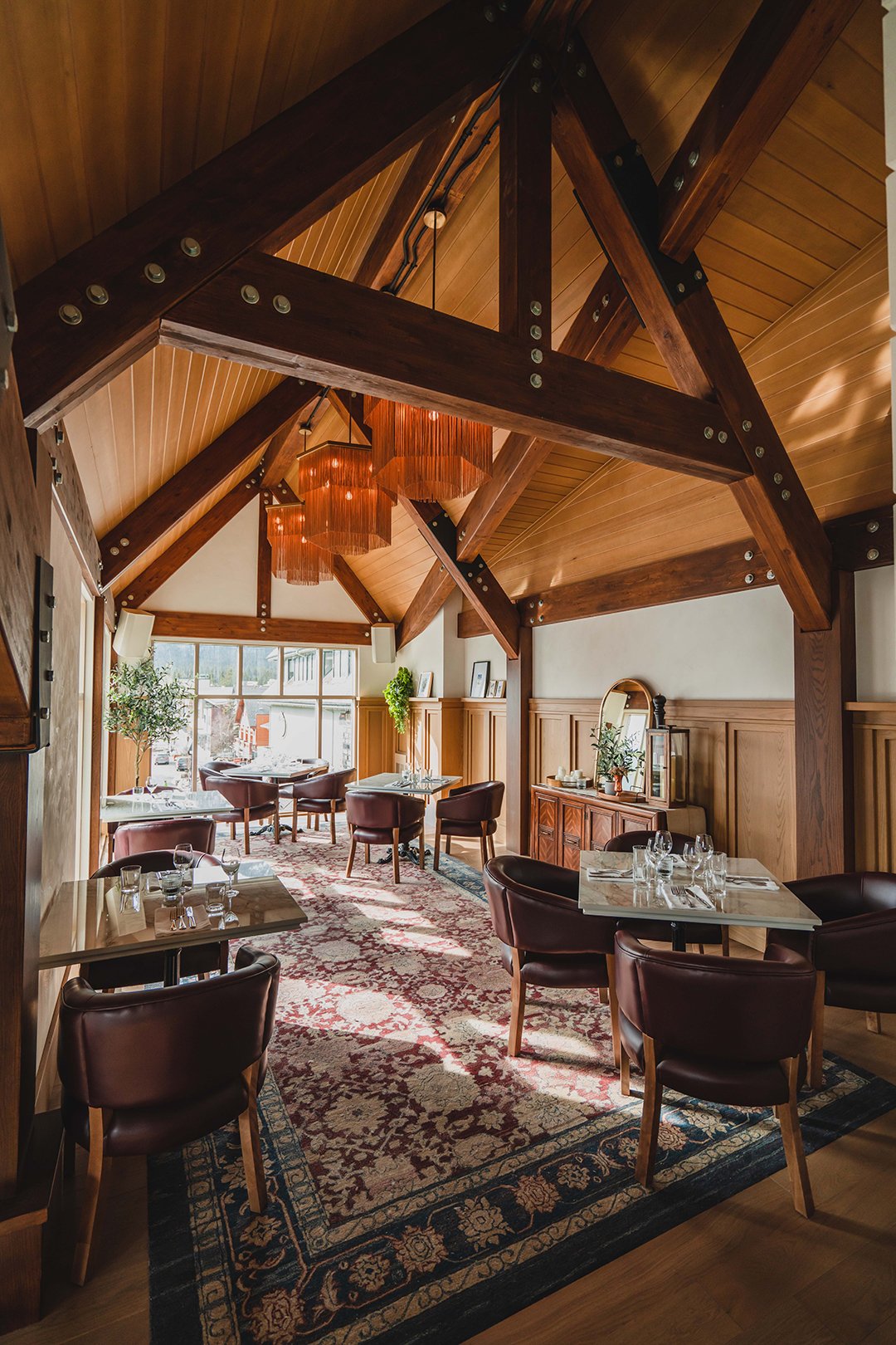 Timber beams, leather chairs and tables in LUPO’s Vistas dining room