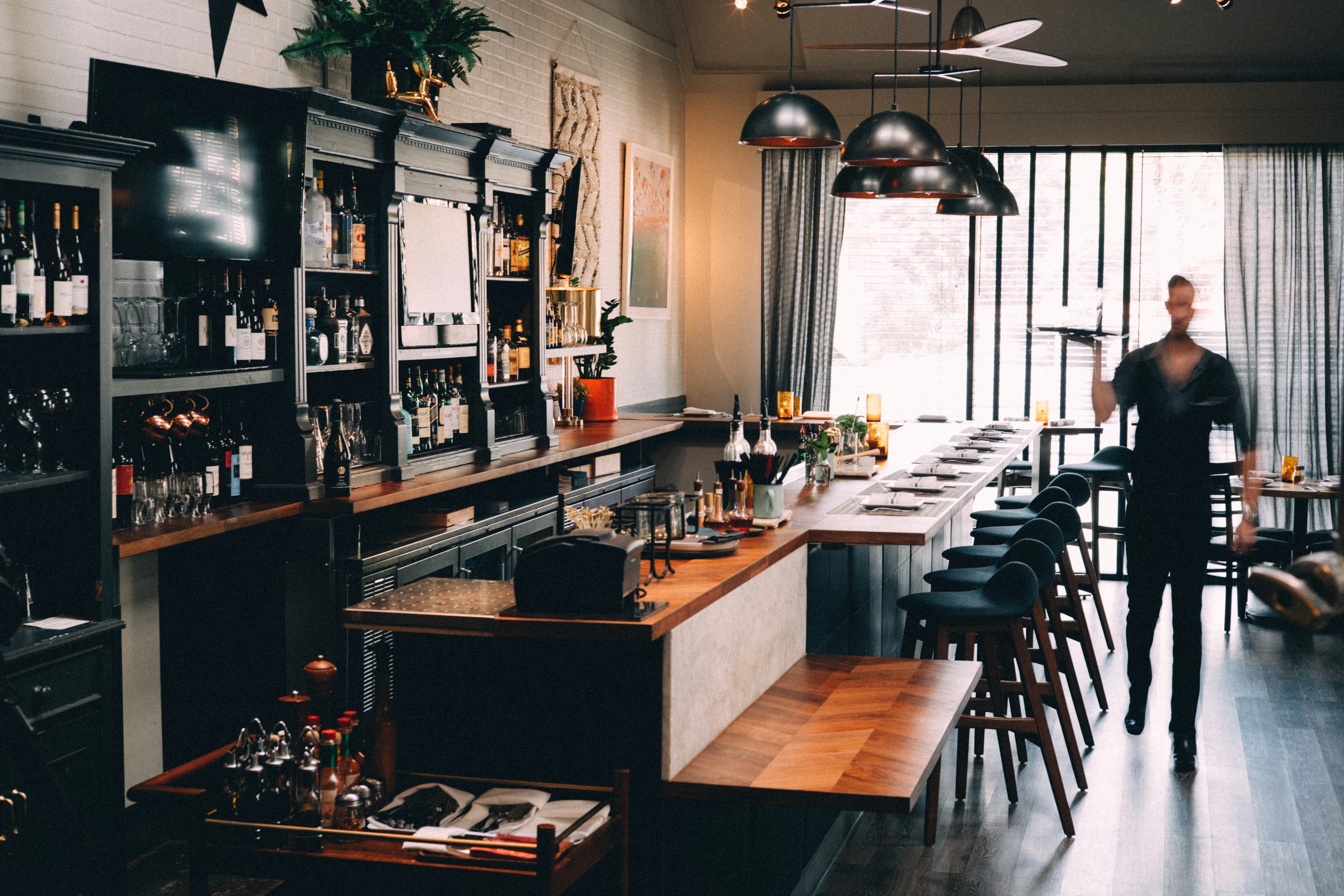 A restaurant dining room and bar