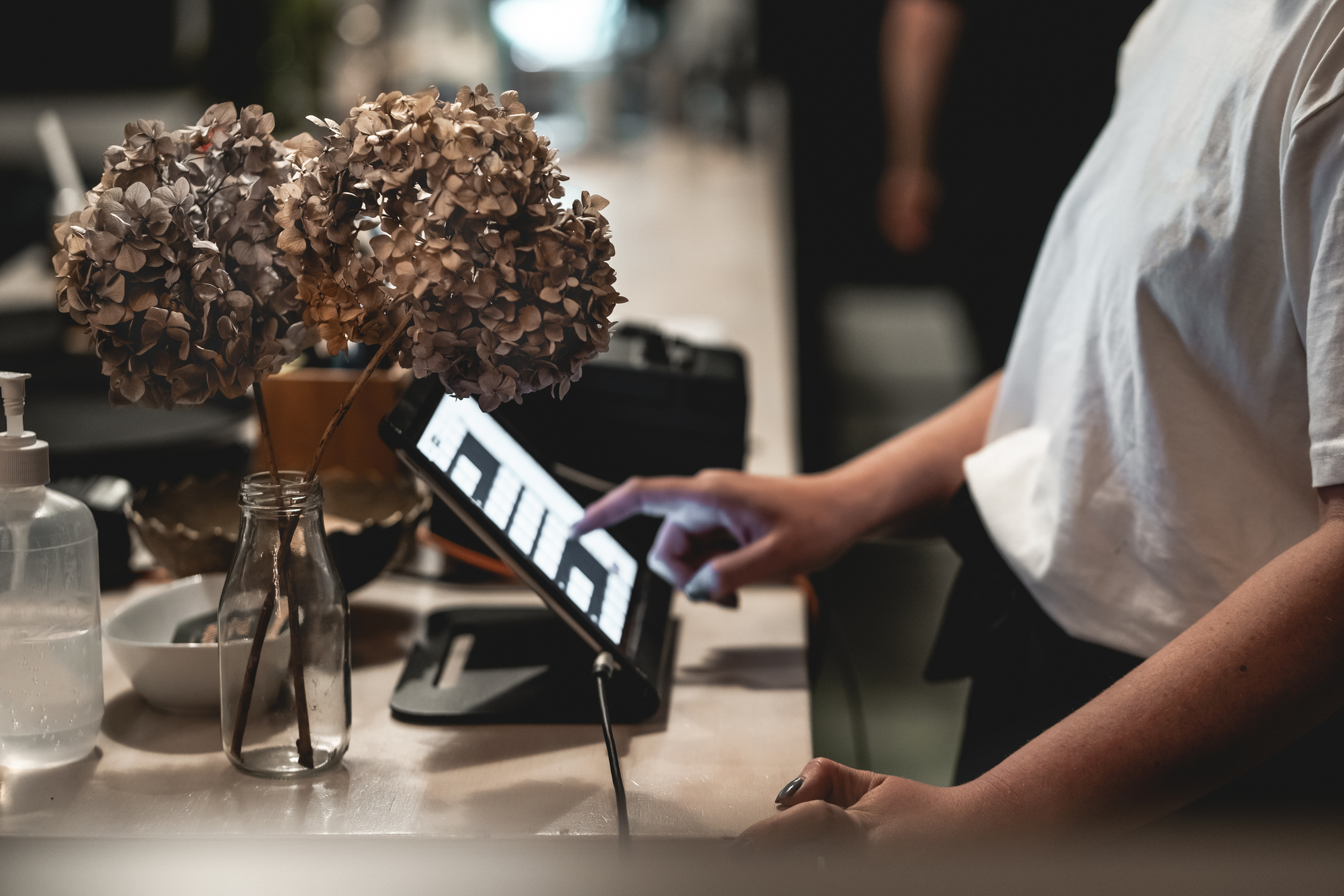 A host confirming a reservation on the host-stand tablet